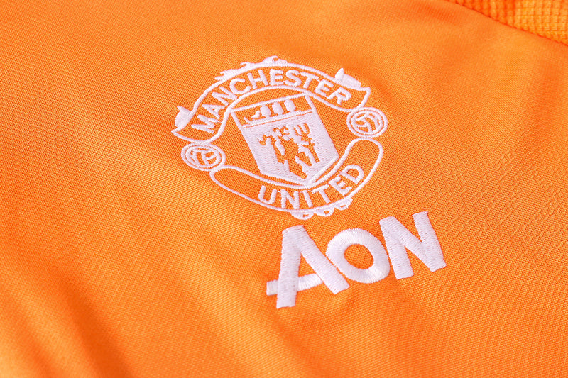 KIT PRÉ JOGO - MANCHESTER UNITED - LARANJA E PRETO