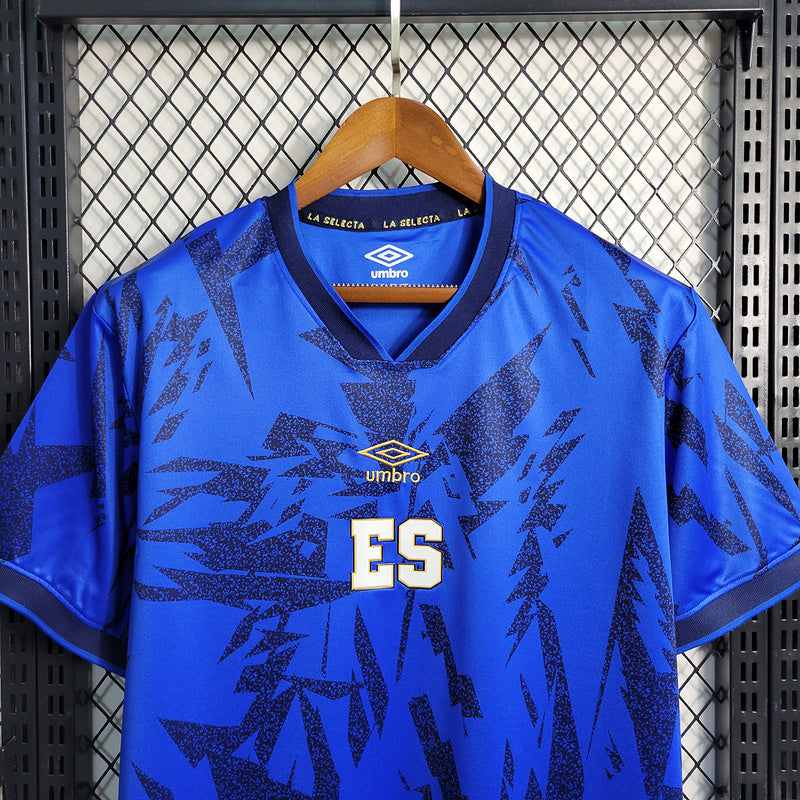 CAMISA EL SALVADOR - CASA/ HOME - TORCEDOR - 23/24