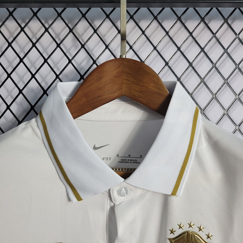 CAMISA  BRASIL - PÓLO -  BRANCA COM ESCUDO DOURADO - CBF - FEMININO - 22/ 23